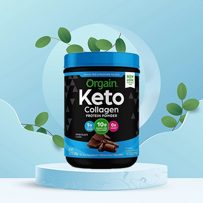 Orgain keto collagen protein powder on blue leafy background