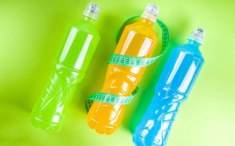 Sport water bottles, Various color bright energy water enhancer drinks on colorful background.