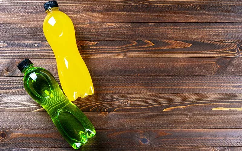 Bottles with yellow and green transparent liquid