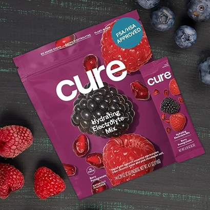 Cure hydration electrolyte mix with berries on dark background