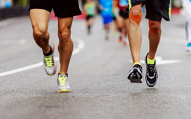 endurance athletes running marathon race