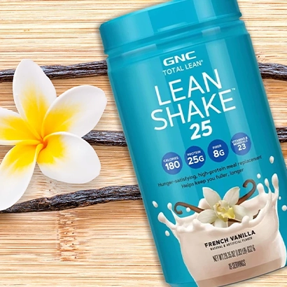 GNC Lean Shake and vanilla on bright wooden background