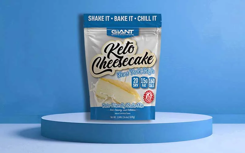 Giant Sports Keto Cheesecake shake mix on a blue podium.