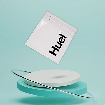 huel meal replacement shake powder on cyan background